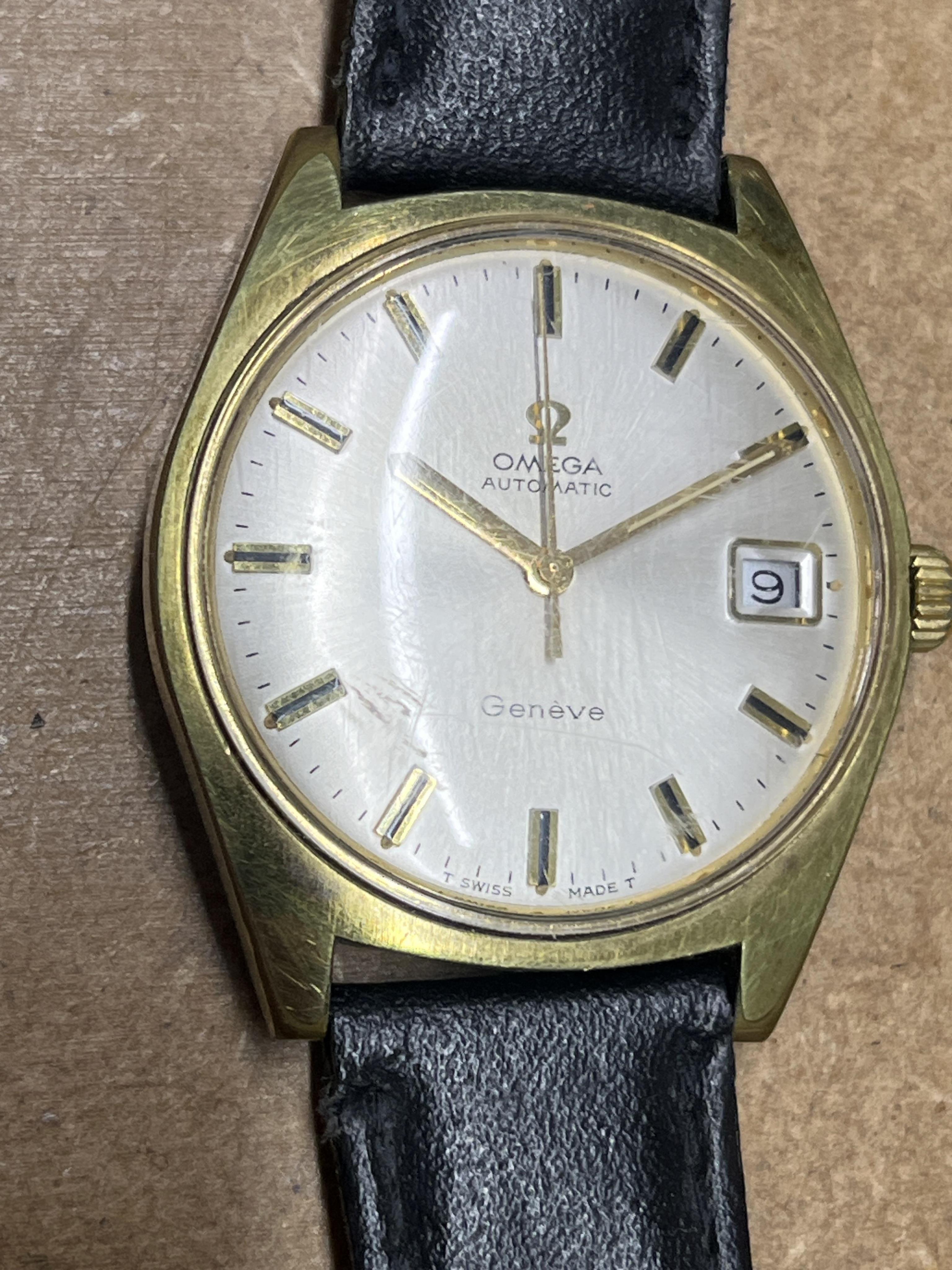 A gentleman's early 1970's Omega steel and gold plated automatic wrist watch, with baton numerals and date aperture, case diameter 35mm, with case back inscription, on an associated leather strap.